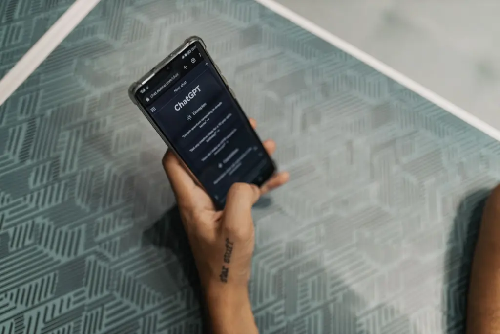 Phone showing an AI chat app, where businesses want to show up in AI search results